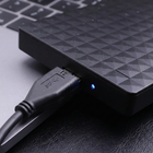 Portable External Hard Drive Detail Close-Up - macro of USB 3.0 port and activity LED indicator