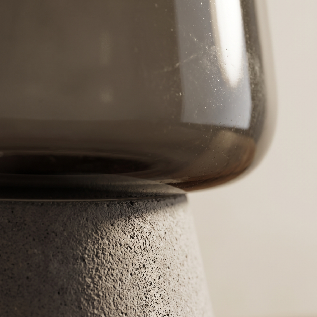 Noctura table lamp macro of tinted glass and stone base detail