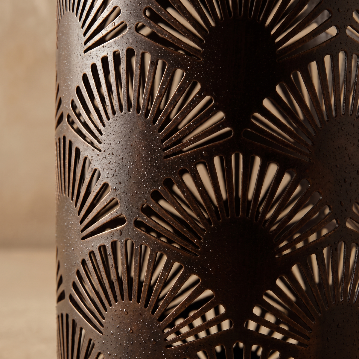 Close-up of Lucerna garden light weatherproof bronze metal cutwork pattern