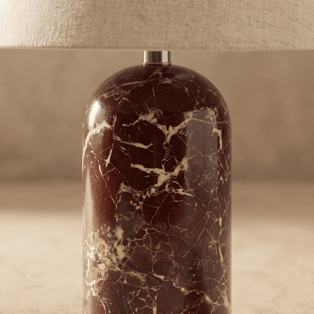 Close-up of Vionelle table lamp red marble veining and cream fabric shade texture