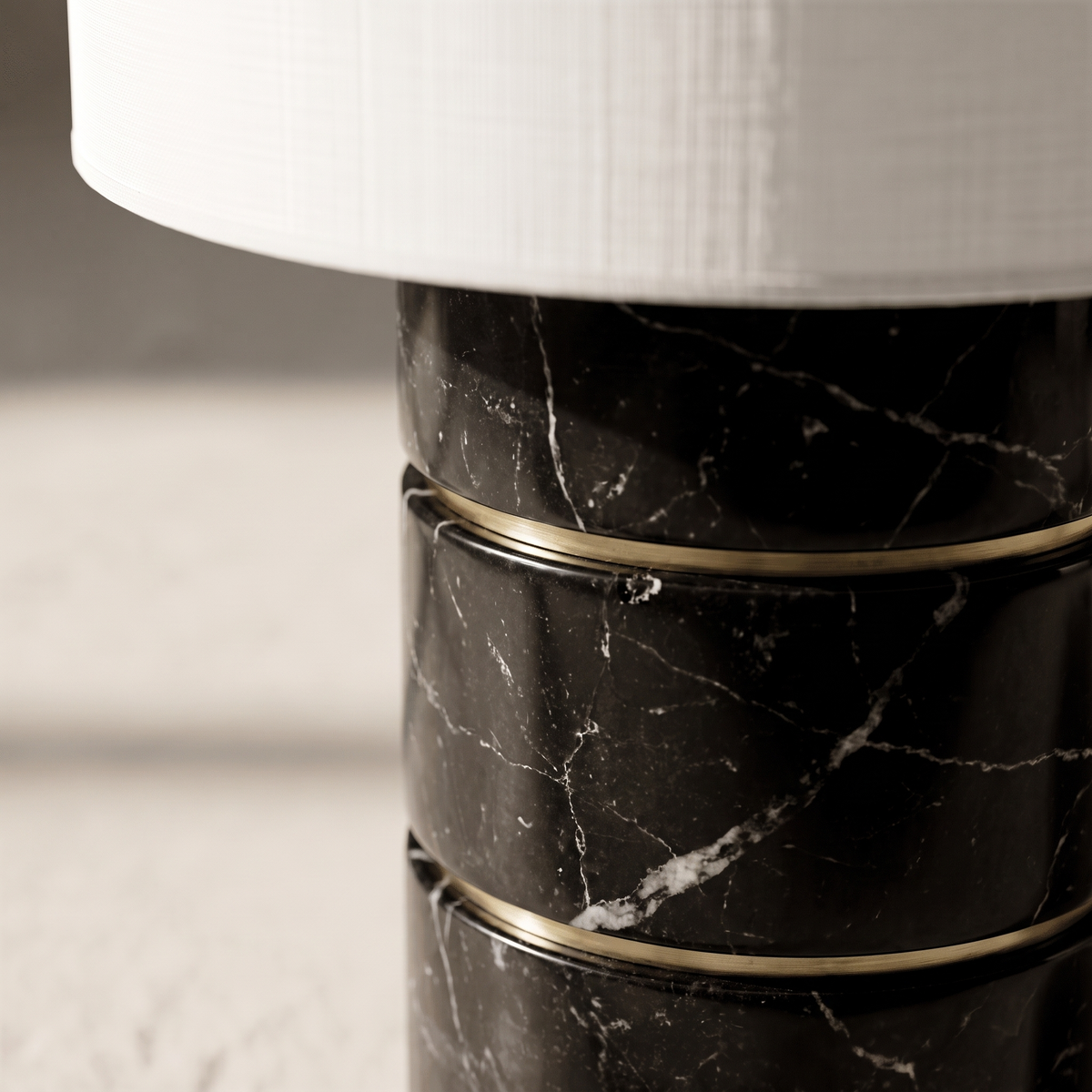 Macro detail of the Cavour lamp's veined black marble segments and brass accent ring