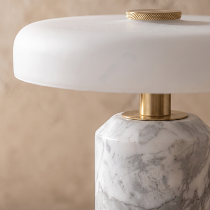 Close-up of the Ophira table lamp glass shade meeting its marble base