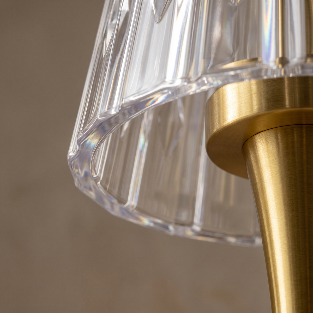 Dorevelle acrylic table lamp, macro detail of the polished clear acrylic edge and metal fitting