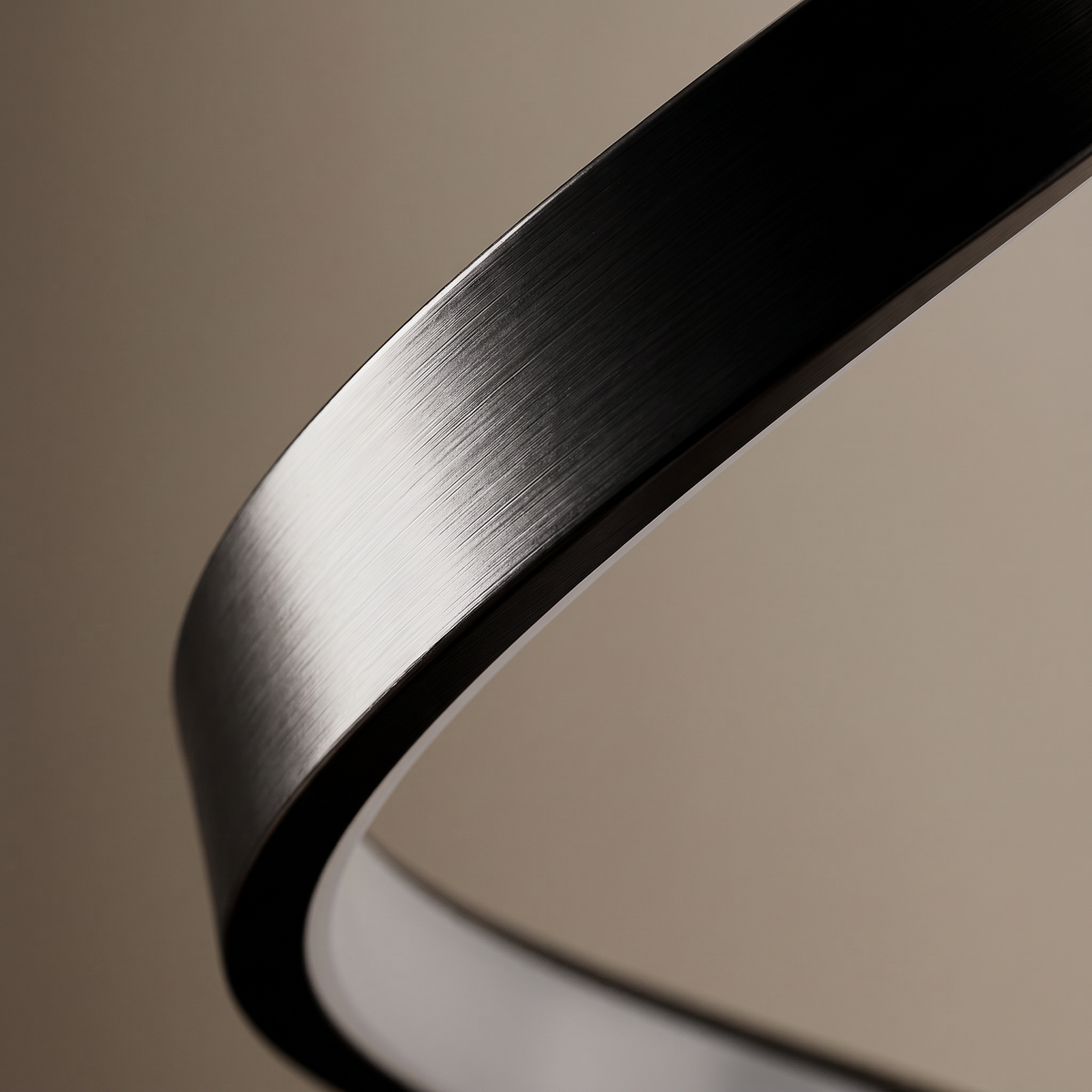 Cordelia aluminum table lamp, macro detail of the brushed metal finish and diffuser seam
