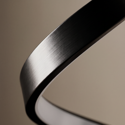 Cordelia aluminum table lamp, macro detail of the brushed metal finish and diffuser seam