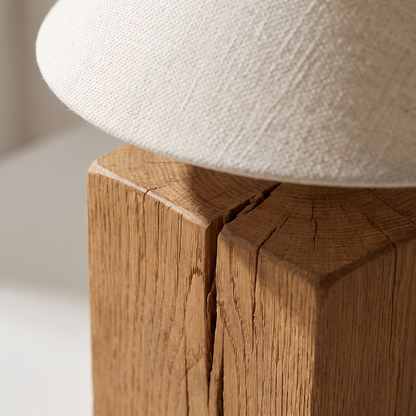 Close-up of the Lavelle table lamp oak grain crack and woven linen shade texture