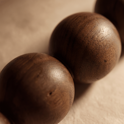 Close-up of the Montrave table lamp turned walnut bobbin curves and polished wood grain