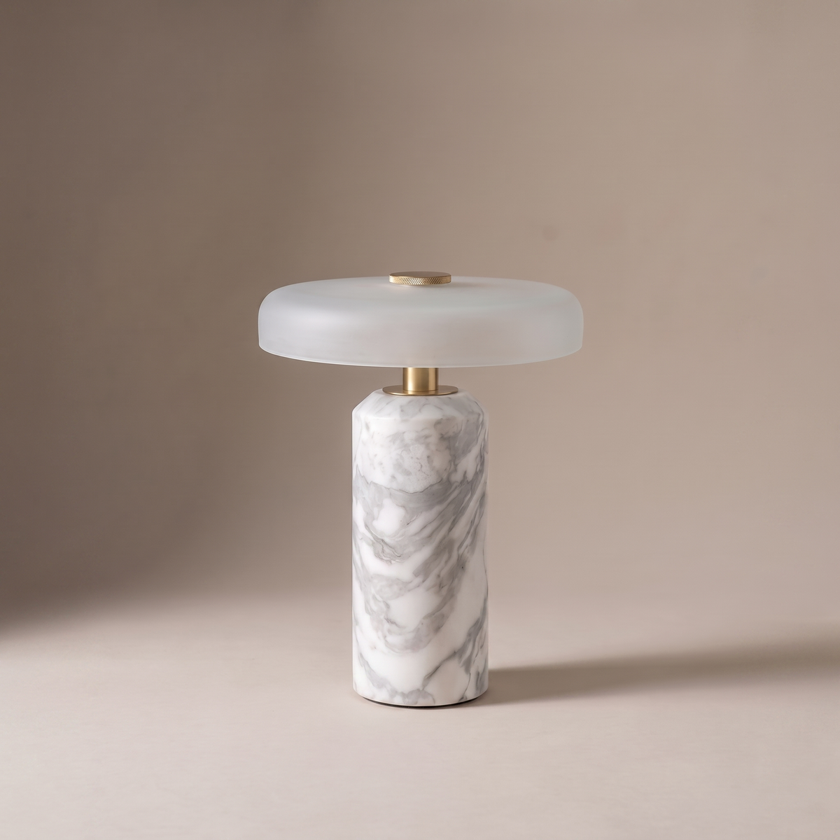 Ophira small glass and marble table lamp on a neutral studio backdrop