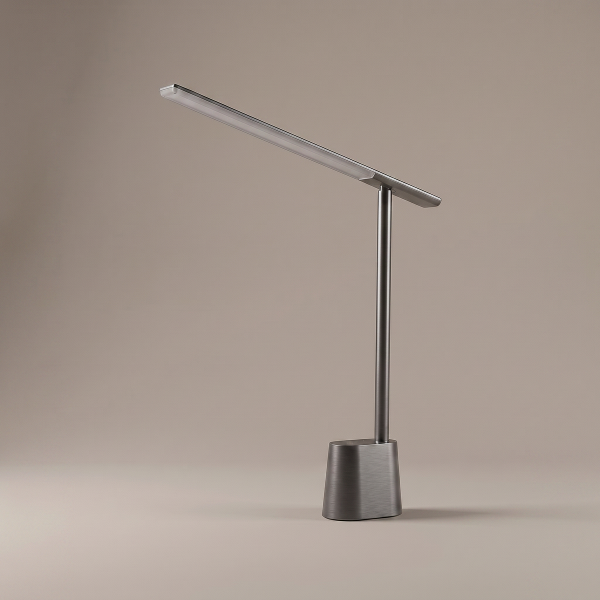 Orsanne aluminum and polycarbonate table lamp, studio shot on warm-greige backdrop, lamp off