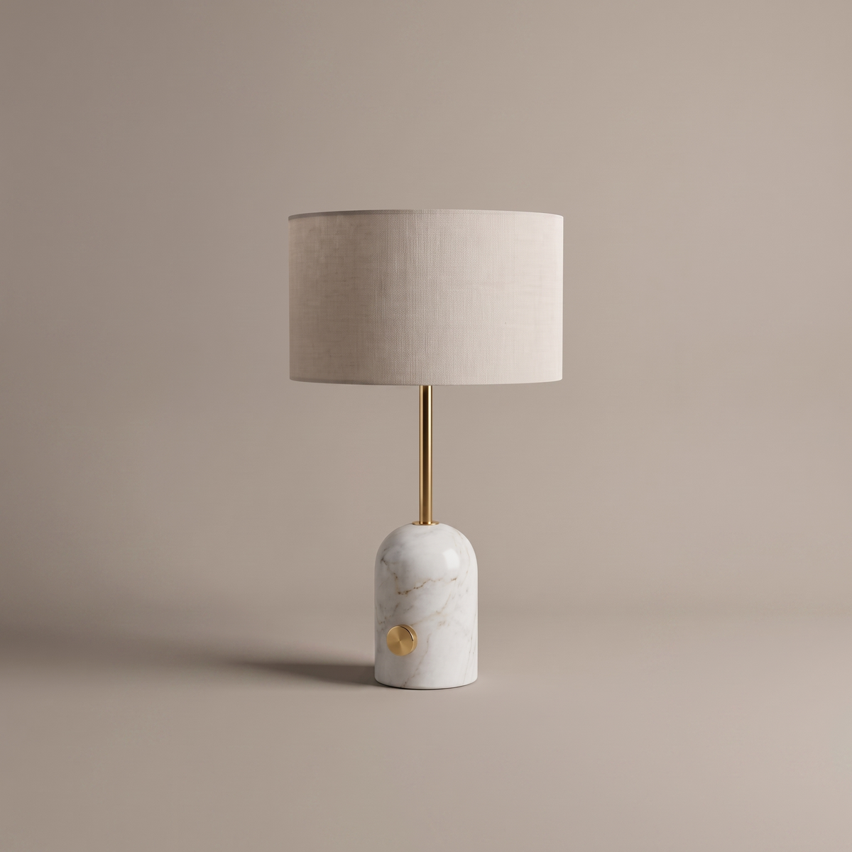 Rivelle modern table lamp with marble base and fabric drum shade on neutral studio backdrop