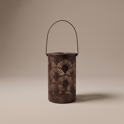Lucerna bronze outdoor garden lantern with ornate cutouts on a neutral studio backdrop