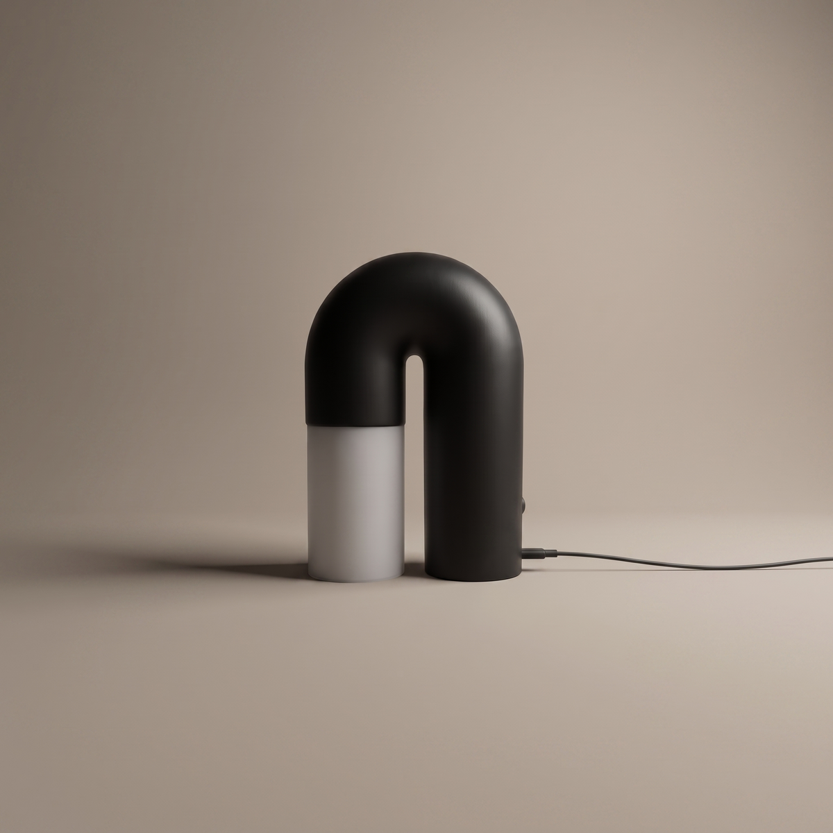 Delacroix black wooden arch table lamp with acrylic diffuser on a neutral studio backdrop