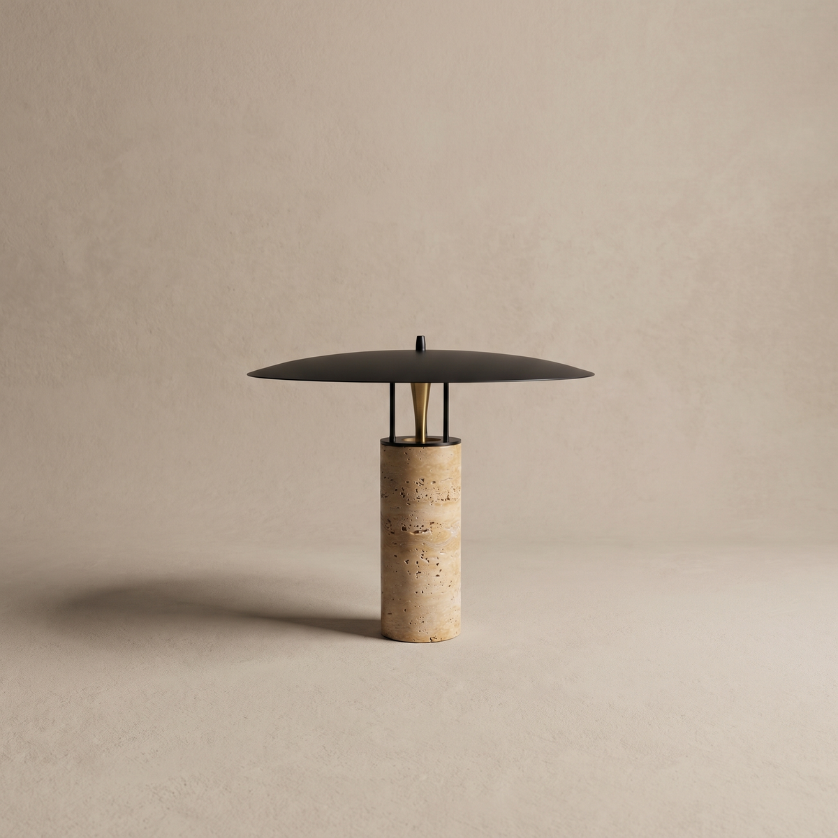 Marcheva marble and travertine table lamp with flat black disc on a neutral studio backdrop