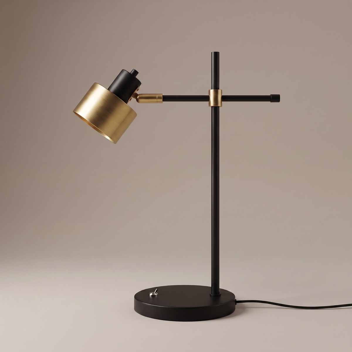 Sablette iron table lamp side profile showing black stem, crossbar arm and brass rotatable head, studio shot
