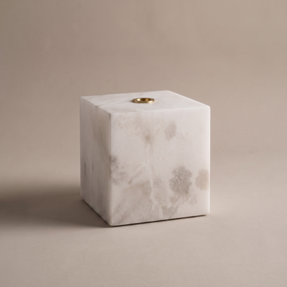 Duvessa solid white alabaster cube table lamp with brass ring detail, studio product shot