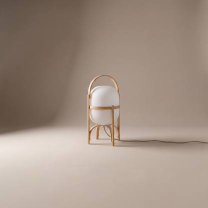 Galante contemporary glass and wood table lamp, clean studio view on neutral warm-greige backdrop