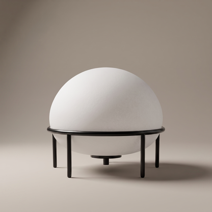 Isolde low-profile black glass and metal table lamp, clean studio view on neutral backdrop