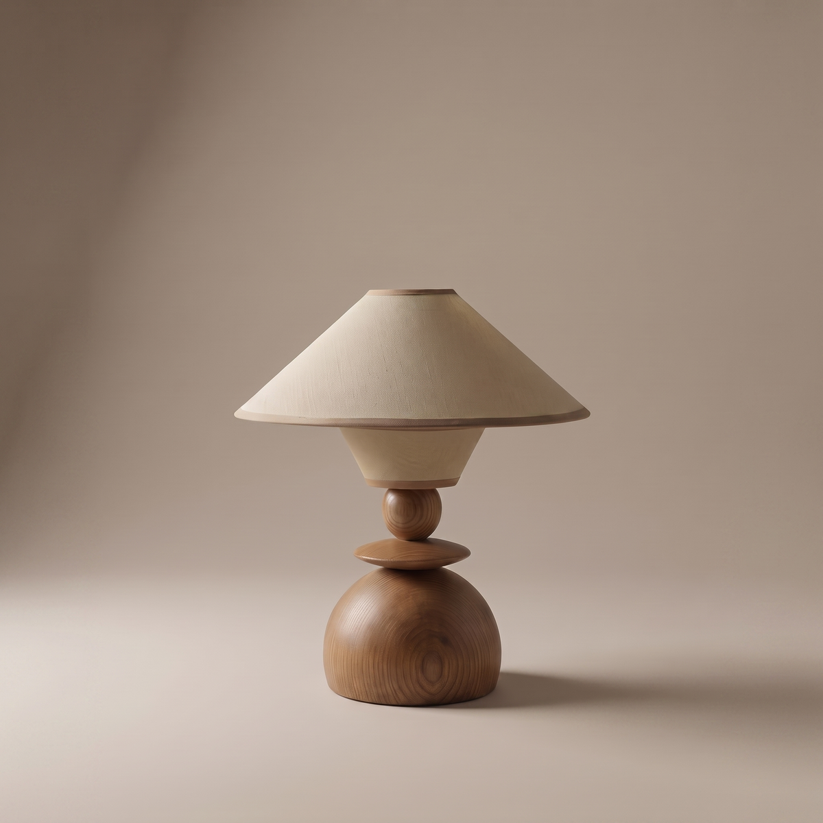 Jouvelle Scandinavian table lamp with beige fabric shade, clean studio view on neutral backdrop