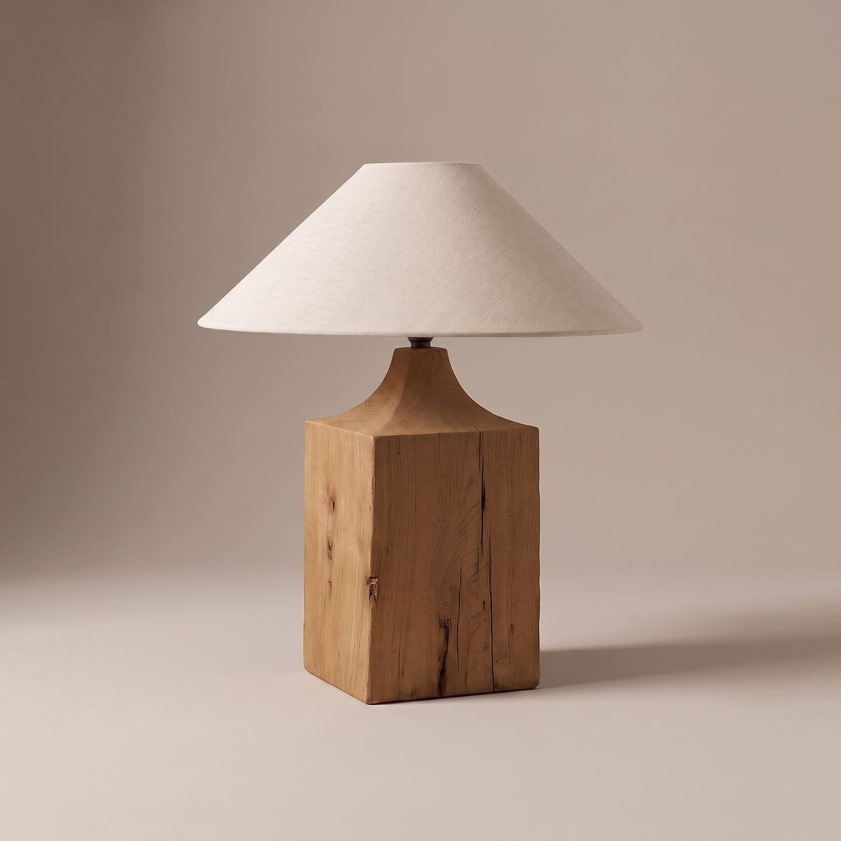 Lavelle rustic table lamp with cracked solid oak base and natural linen cone shade on studio backdrop