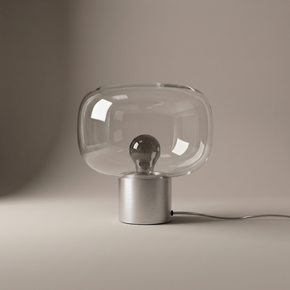 Vercelli compact aluminum and clear glass table lamp, studio product shot