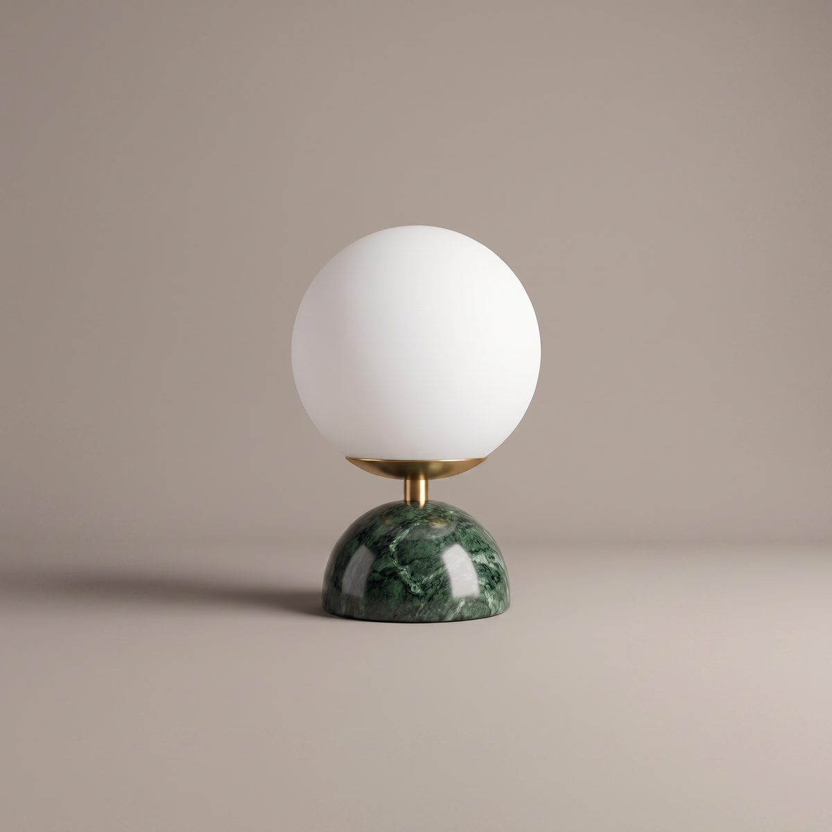 Willowmere modern table lamp with green marble base and brass stem, studio product shot