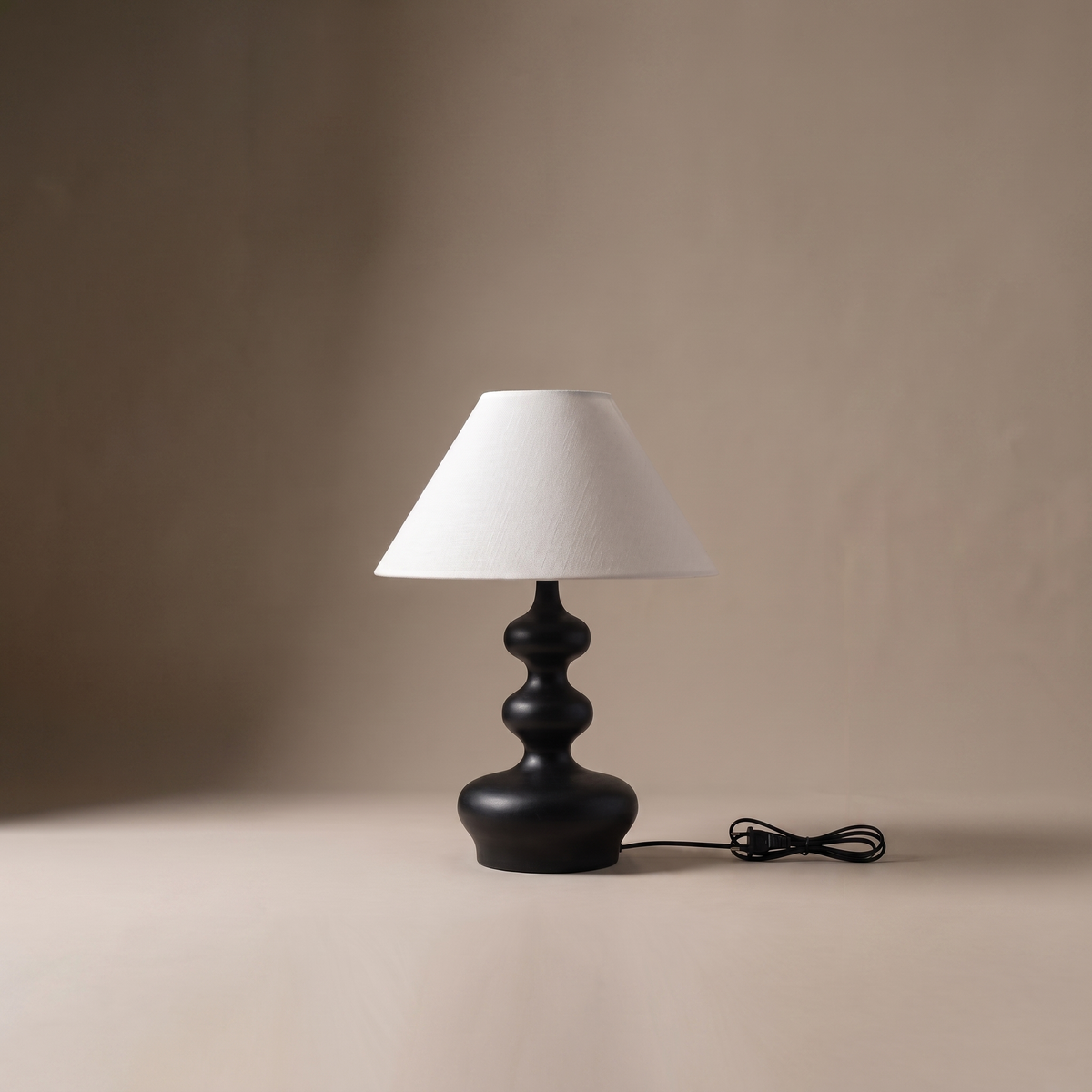 Xanthe sculptural fabric and wood boho table lamp, studio product shot