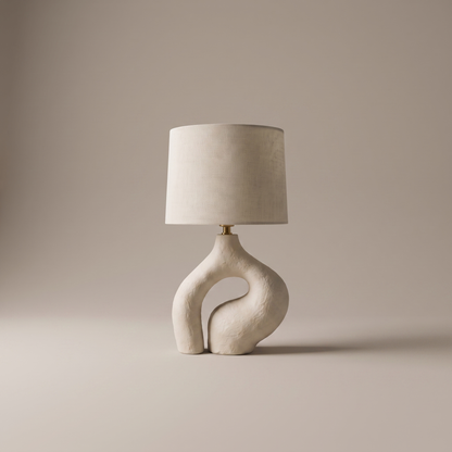 Ysoline table lamp with fabric shade and sculpted resin base, studio product shot