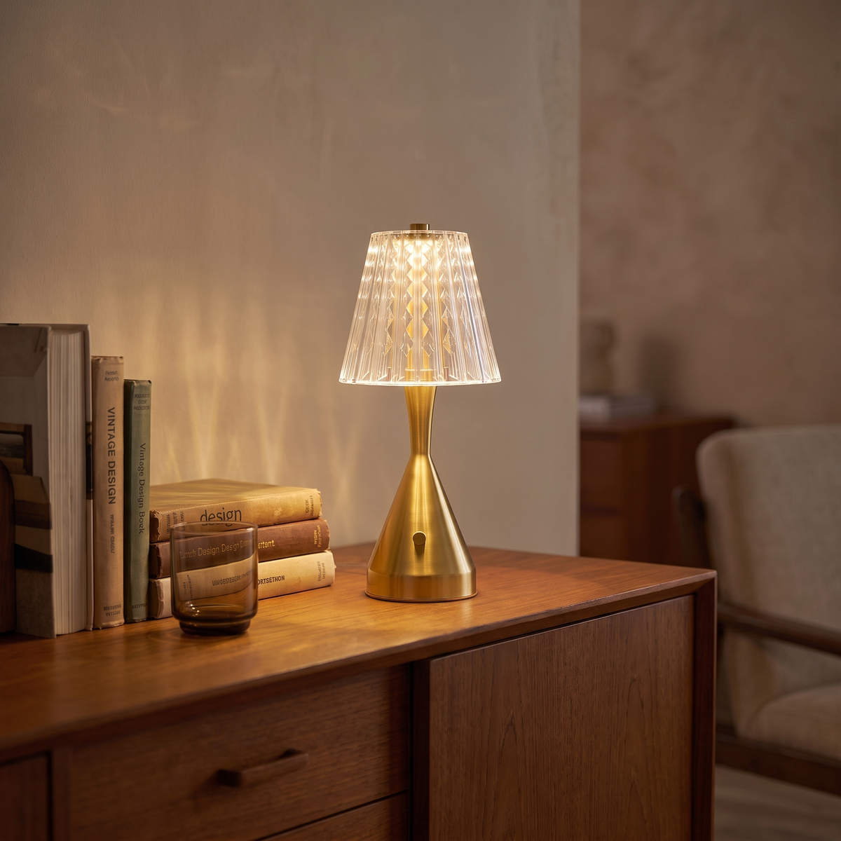 Dorevelle retro acrylic LED table lamp lit at dusk on a teak living room sideboard
