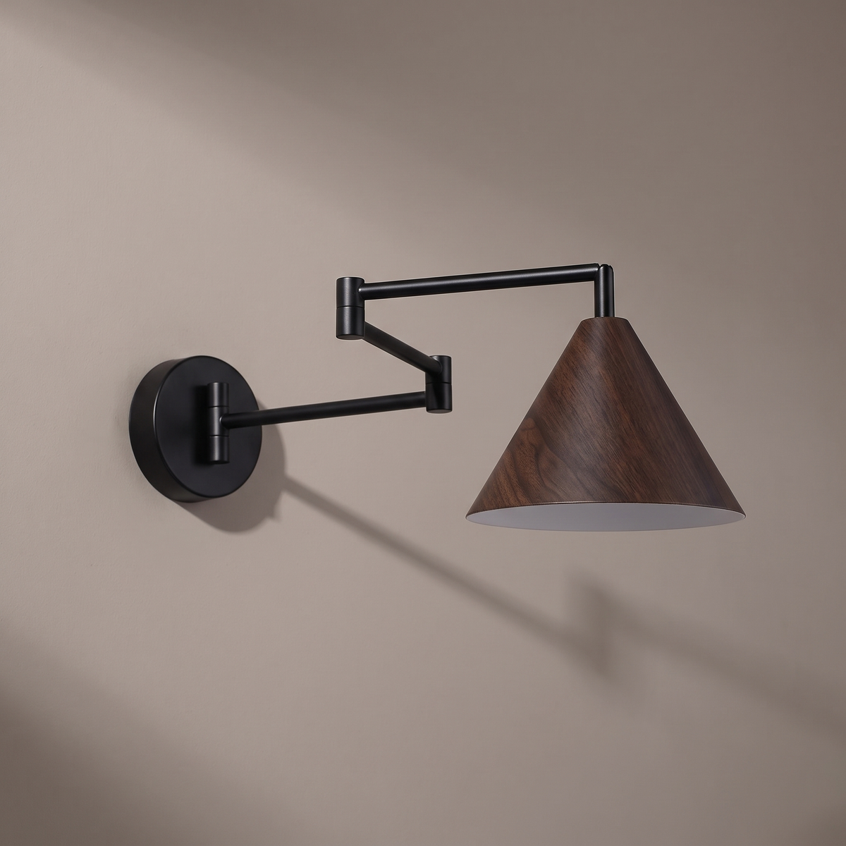 Nordic black iron swing arm wall sconce with walnut wood-grain cone shade, lamp off, arm extended on a plain greige plaster wall