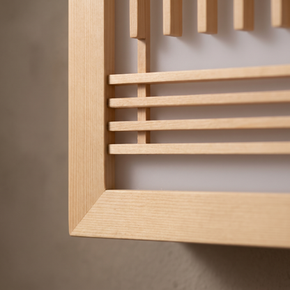 Close-up of the natural wood slats, mitred frame joint and frosted acrylic panel of the Japanese wall sconce