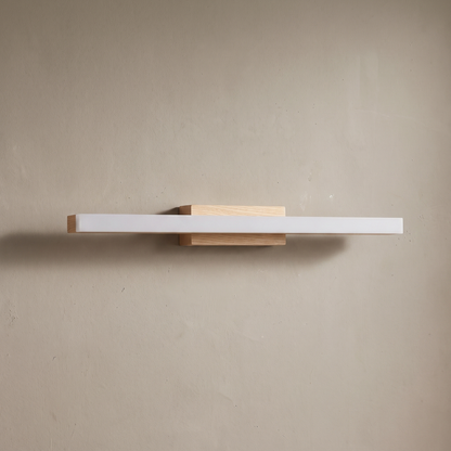 Beige natural wood strip vanity wall sconce with frosted acrylic diffuser, lamp off on a warm greige plaster wall