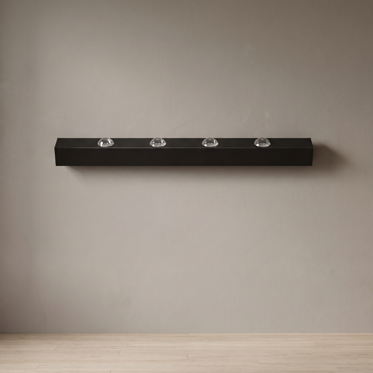 Modern LED water ripple wall wash light, 100 cm matte black aluminum bar with four crystal acrylic lenses, mounted on a plain greige plaster wall, light off