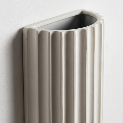 Close-up of the fluted tile-like ribs and matte white resin texture of the Nordic 2-light wall sconce