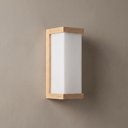 Natural oak wood and square white frosted glass column wall sconce on a plain greige plaster wall, lamp off