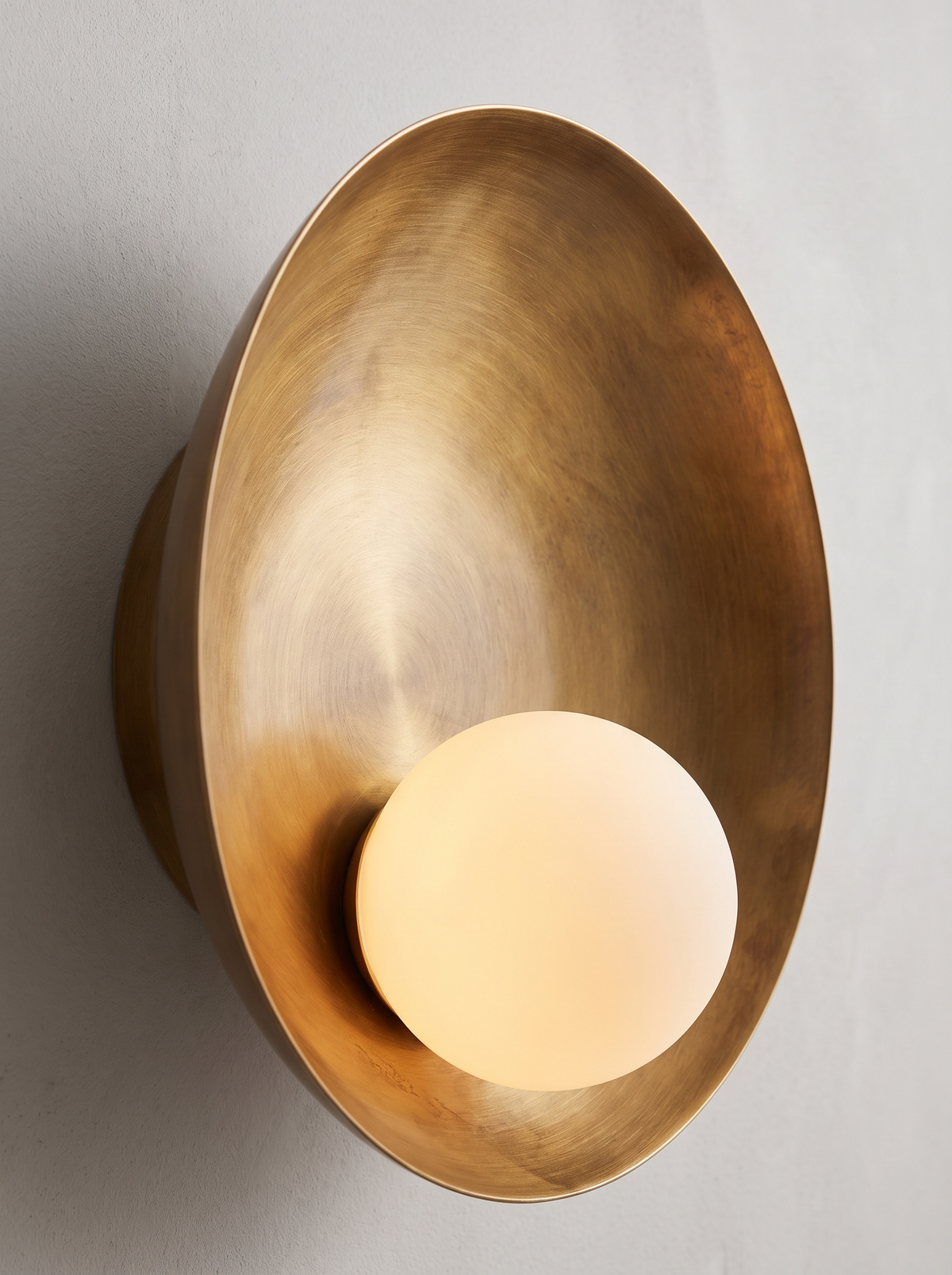 Quintessa wall sconce close up, Three Materials, One Form