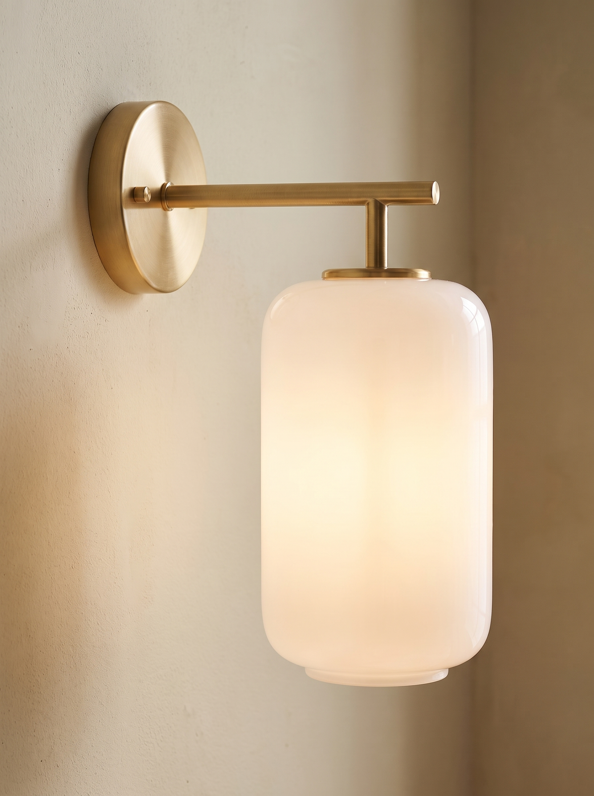 Serandelle wall sconce close up, Cast in Warm Brass
