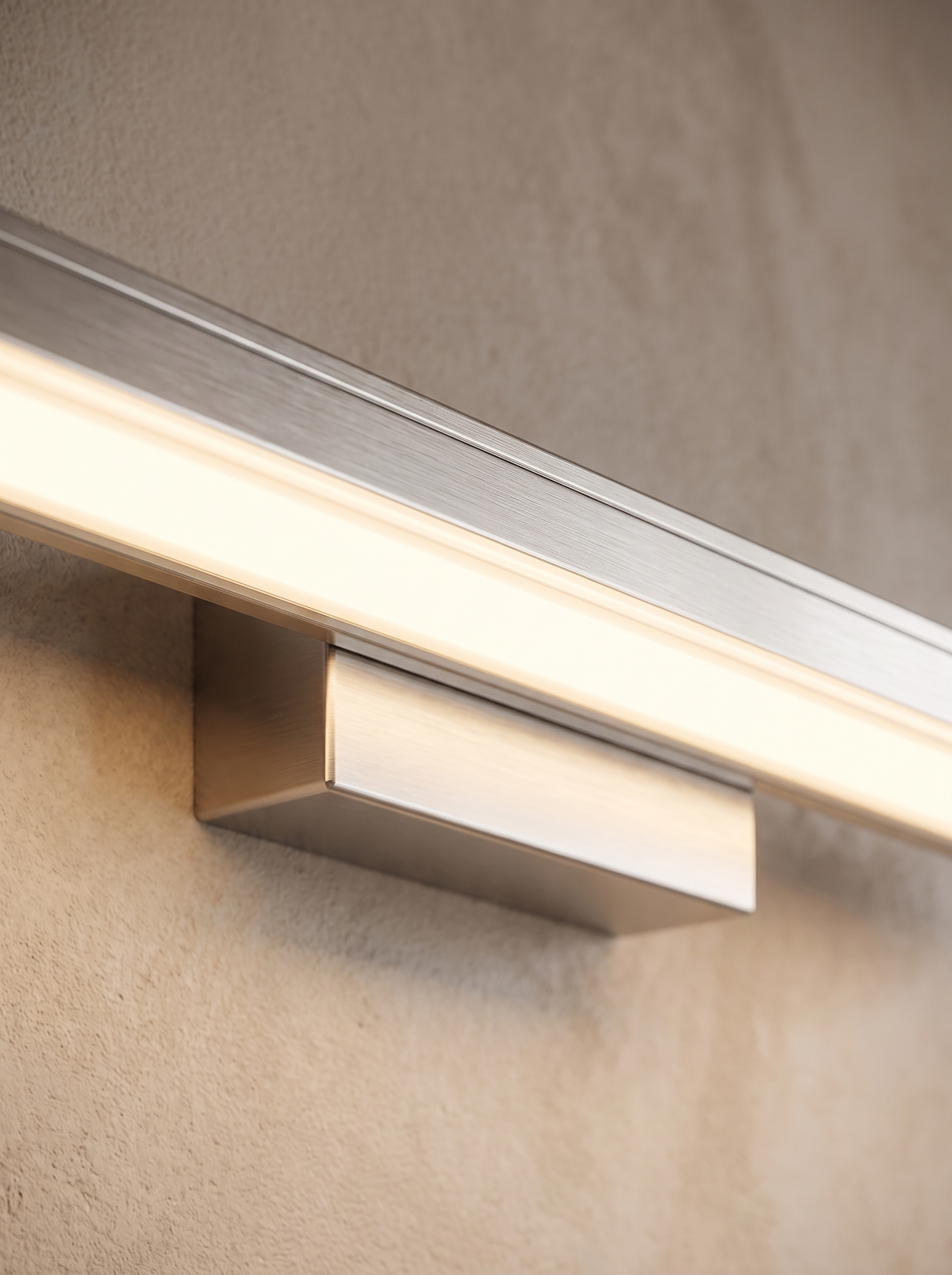 Nivelle wall sconce close up, Steel That Shrugs Off Time