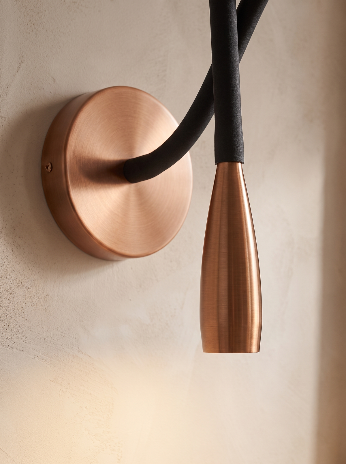 Quenelle wall sconce close up, Cast in Warm Copper